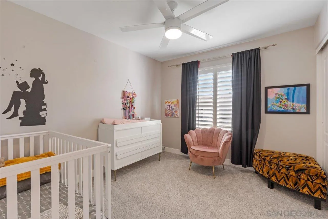 219 Jacob Lane Encinitas, CA 92024 - Photo 25 of 46 a bedroom with furniture and a window