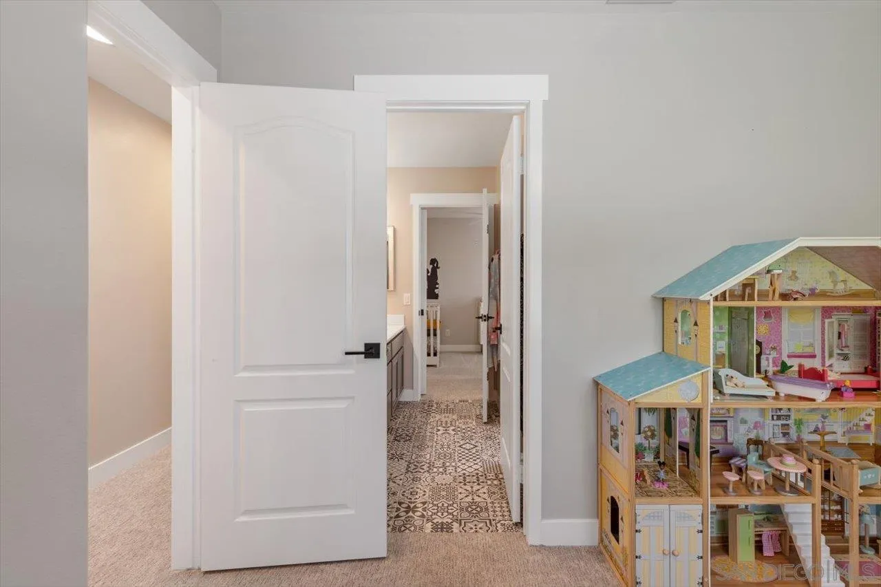 219 Jacob Lane Encinitas, CA 92024 - Photo 29 of 46 a view of a bedroom from a hallway