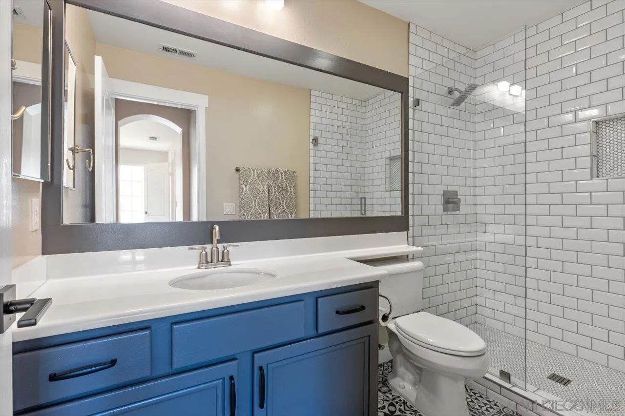 219 Jacob Lane Encinitas, CA 92024 - Photo 32 of 46 a bathroom with a sink toilet and shower