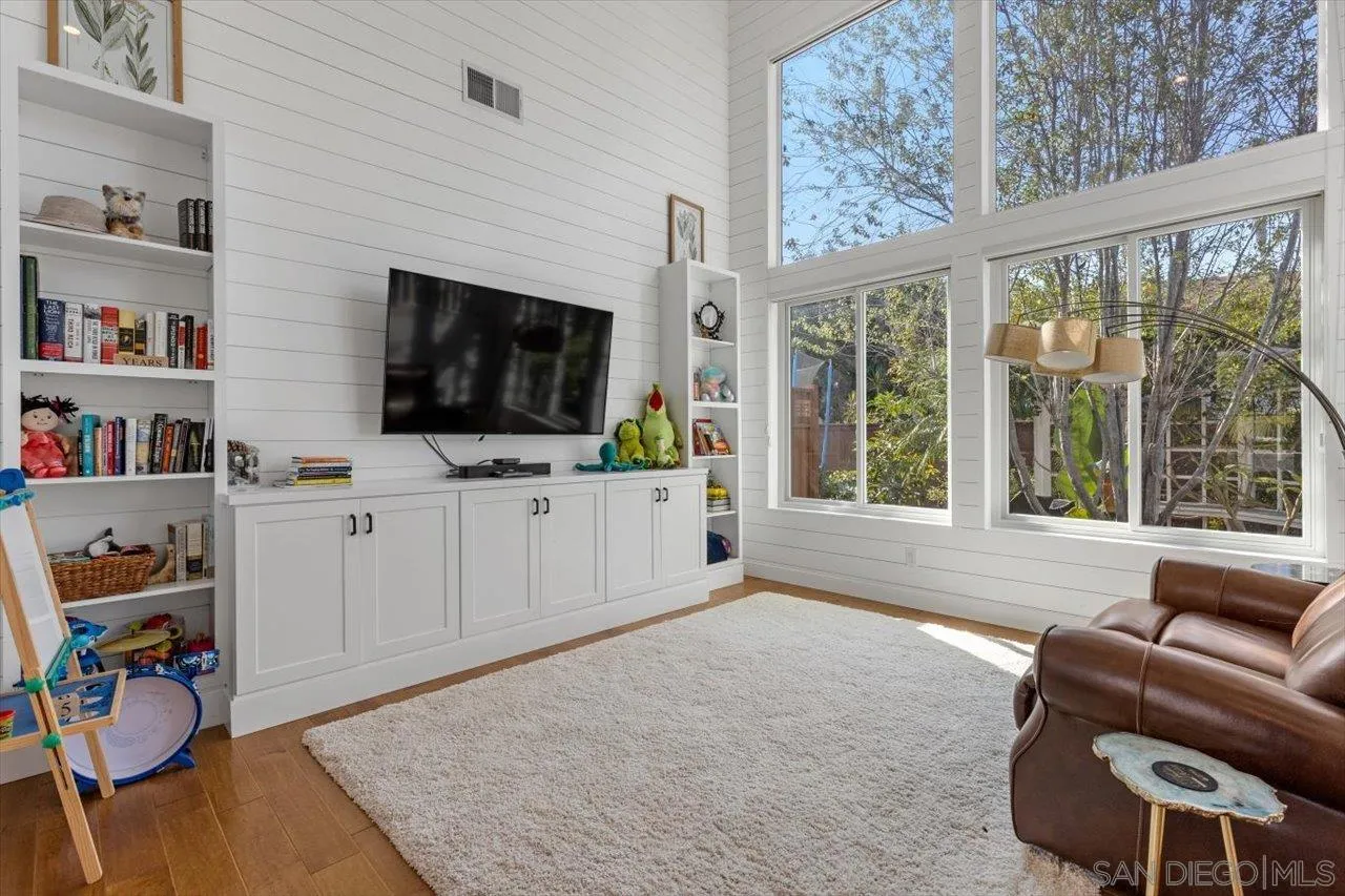 219 Jacob Lane Encinitas, CA 92024 - Photo 5 of 46 a living room with furniture and a flat screen tv