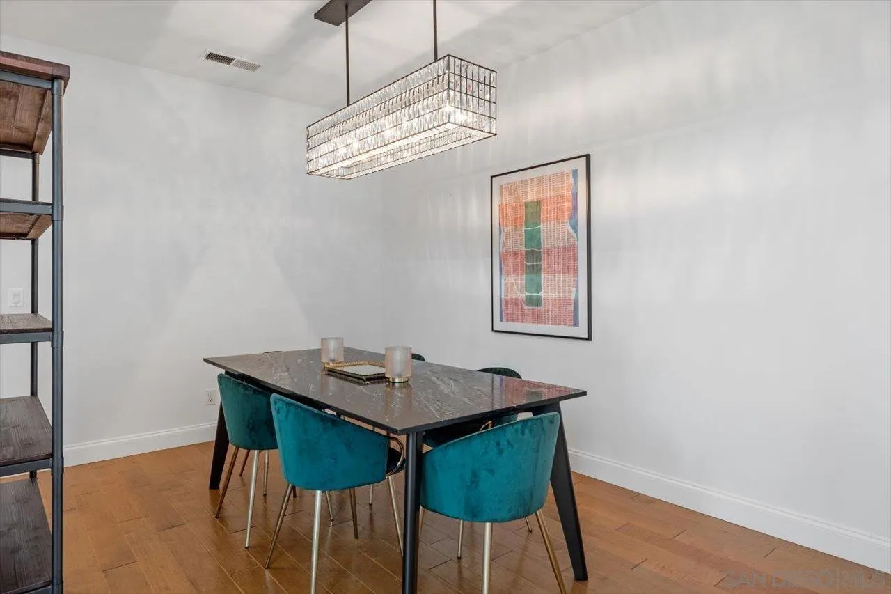 219 Jacob Lane Encinitas, CA 92024 - Photo 8 of 46 a view of a dining room with furniture and wooden floor