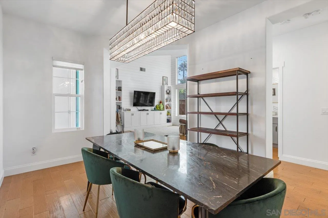 219 Jacob Lane Encinitas, CA 92024 - Photo 9 of 46 a view of a dining room with furniture and wooden floor