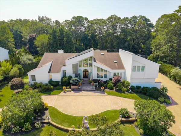 a aerial view of a house with swimming pool and garden