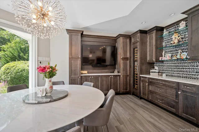 a view of a dining room with furniture window and wooden floor