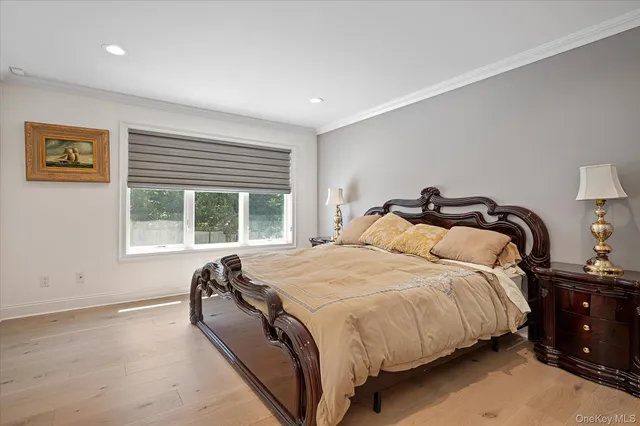 a bedroom with bed and window