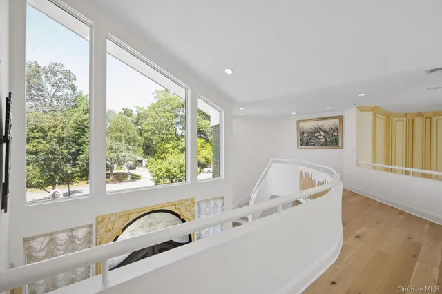 a bath tub sitting in a bathroom next to a window