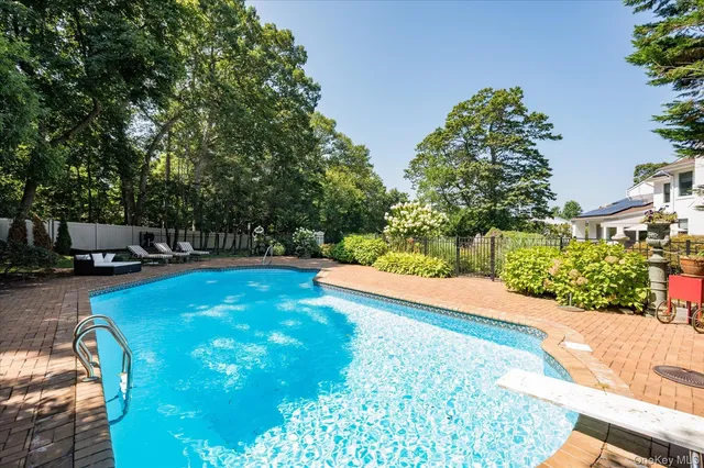 a view of a swimming pool with a patio