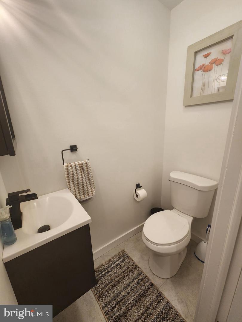 1247 South Newkirk Street Philadelphia, PA 19146 - Photo 11 of 20 a bathroom with a sink toilet and a window
