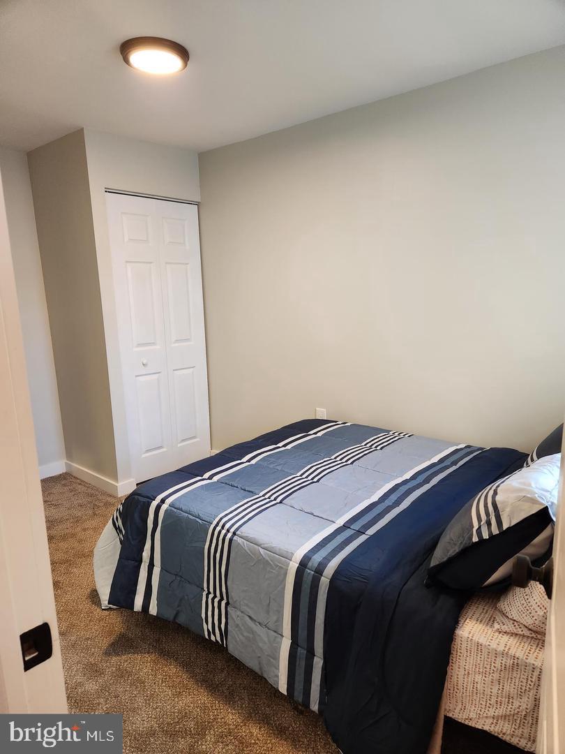 1247 South Newkirk Street Philadelphia, PA 19146 - Photo 15 of 20 a bedroom with a bed and a mirror