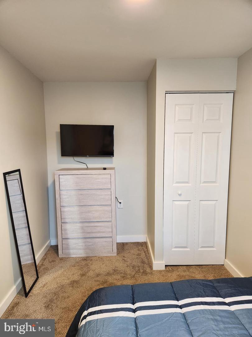 1247 South Newkirk Street Philadelphia, PA 19146 - Photo 16 of 20 a view of room with wooden floor and washing machine