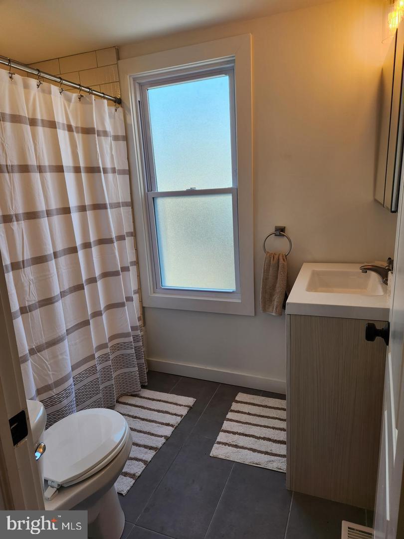 1247 South Newkirk Street Philadelphia, PA 19146 - Photo 17 of 20 a bathroom with a sink toilet and shower