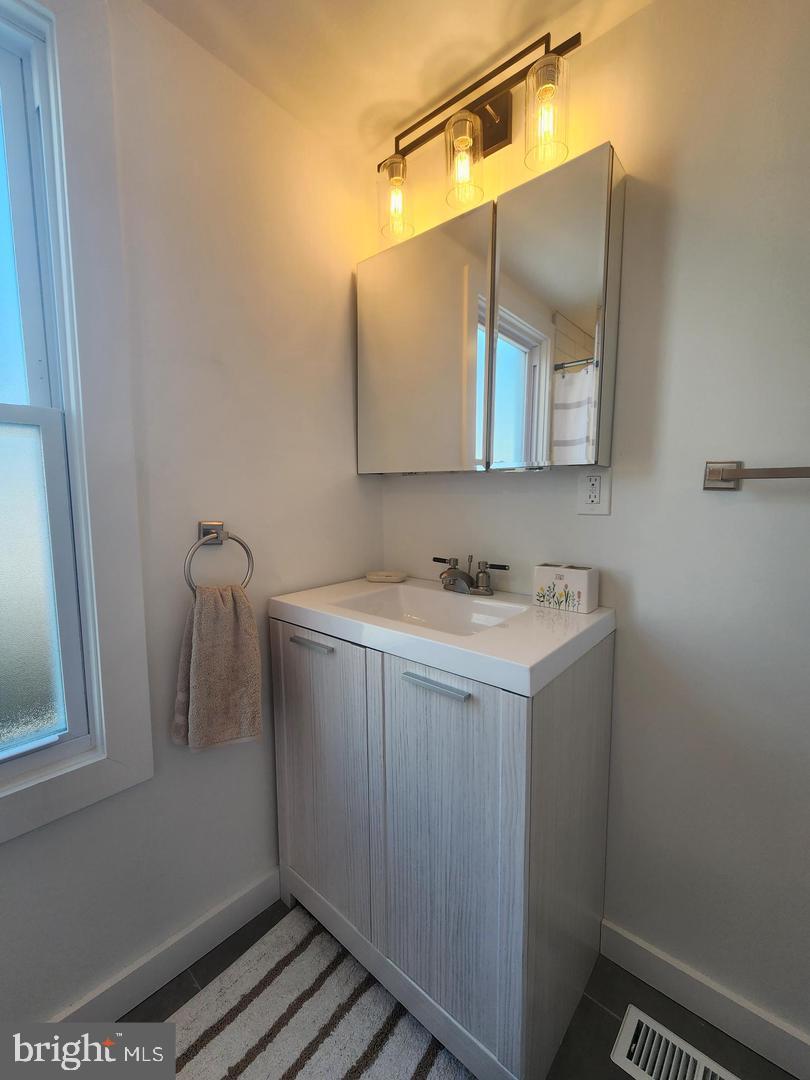1247 South Newkirk Street Philadelphia, PA 19146 - Photo 18 of 20 a bathroom with a sink and mirror