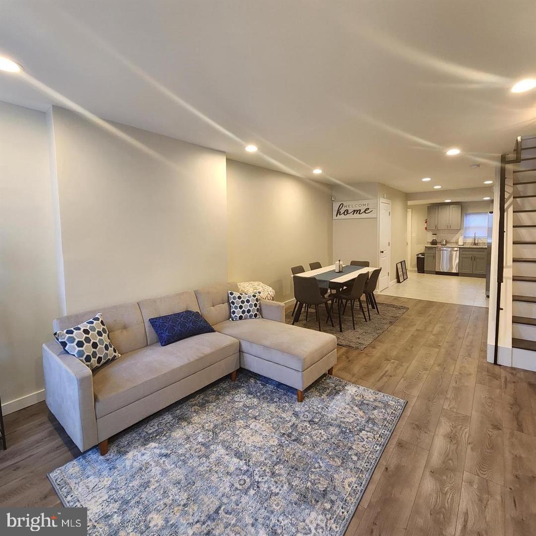 1247 South Newkirk Street Philadelphia, PA 19146 - Photo 2 of 20 a living room with furniture and view of kitchen