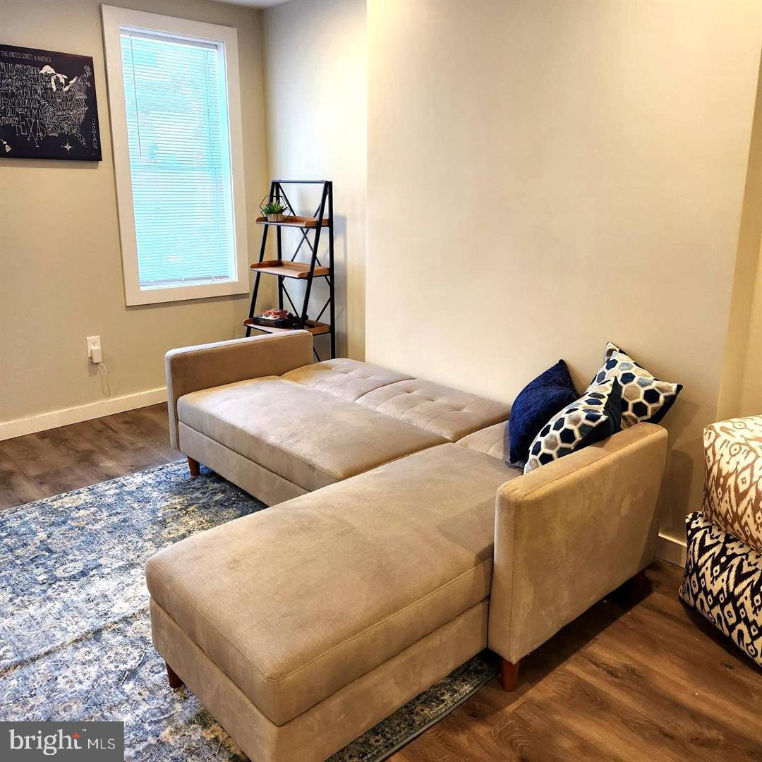 1247 South Newkirk Street Philadelphia, PA 19146 - Photo 4 of 20 a bedroom with two beds and a dresser with wooden floor