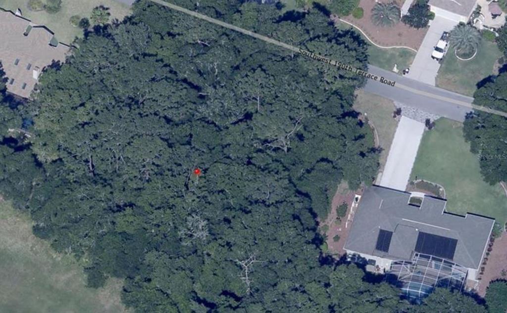 Southwest 190th Terrace Dunnellon, FL 34432 - Photo 2 of 3 an aerial view of a house with a yard