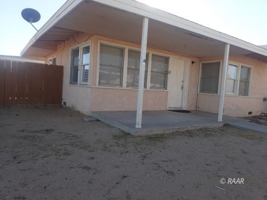 417 South Richmond Road Ridgecrest, CA 93555 - Photo 5 of 7 a view of a house with a backyard