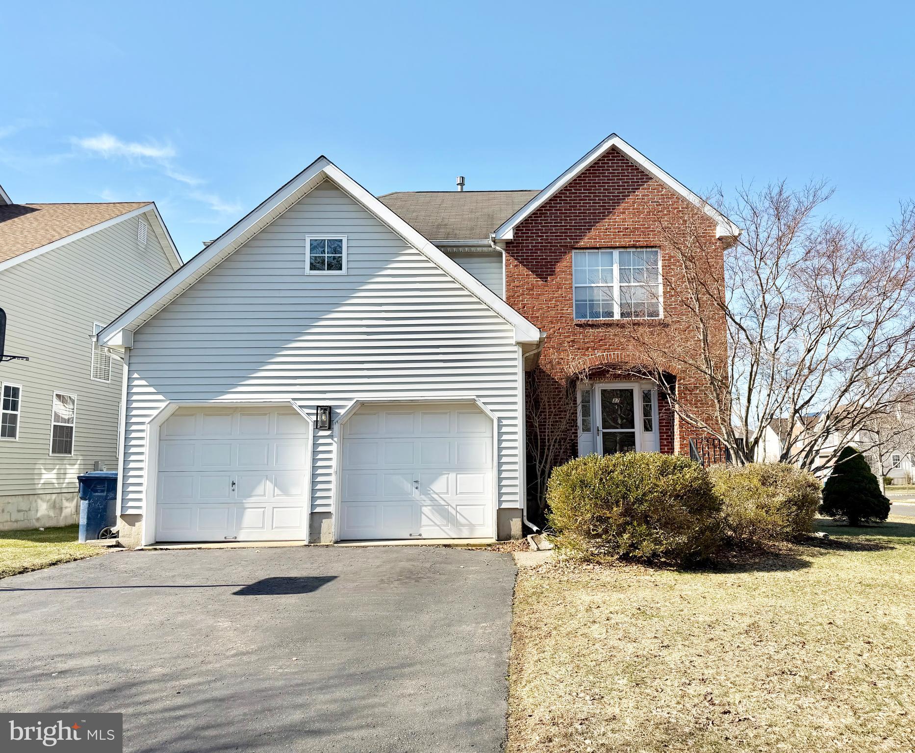 37 Richards Road Lawrenceville, NJ 08648 - Photo 1 of 25 a front view of a house with a yard and garage
