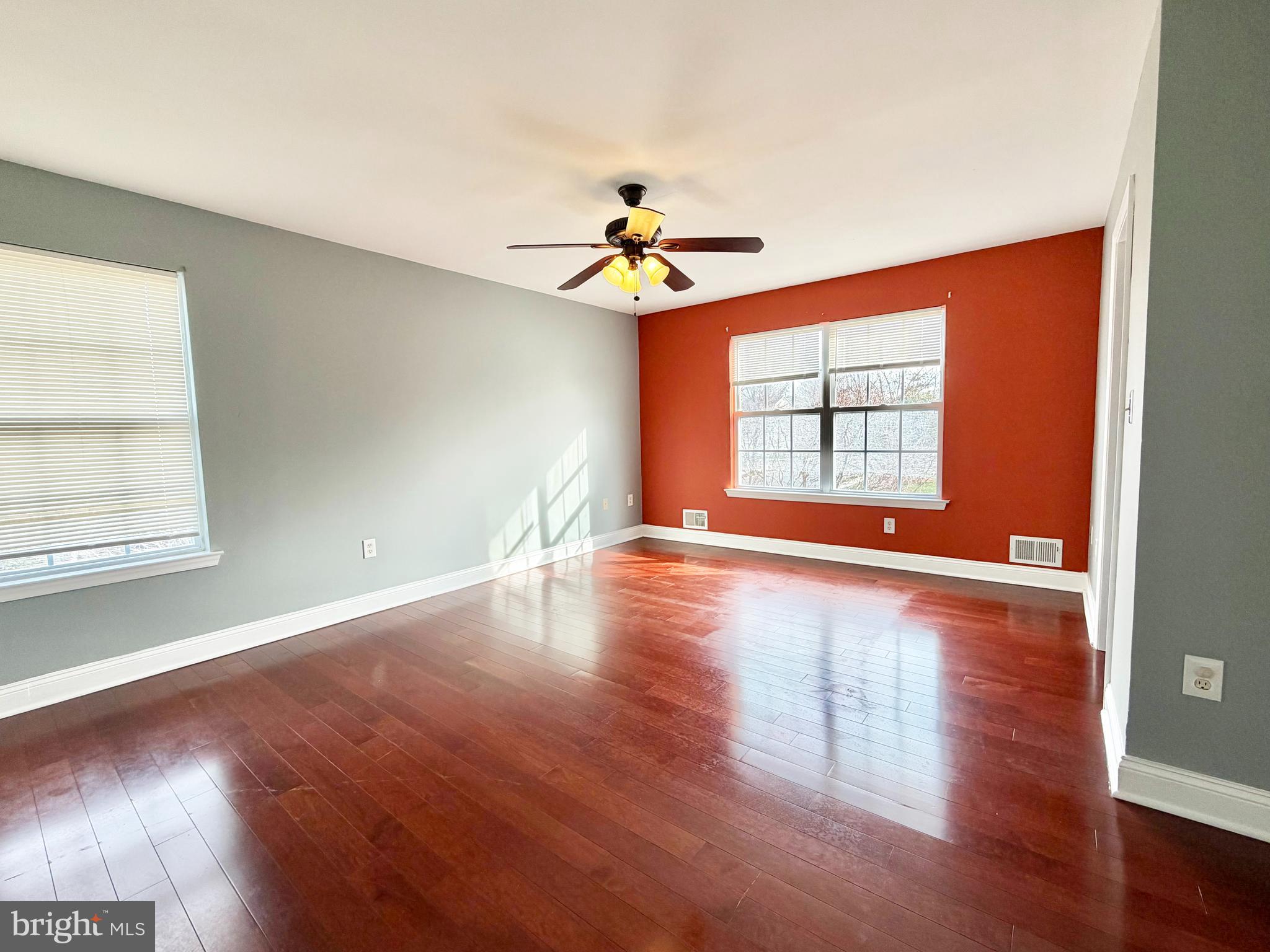 37 Richards Road Lawrenceville, NJ 08648 - Photo 12 of 25 a view of a livingroom with wooden floor a chandelier and windows