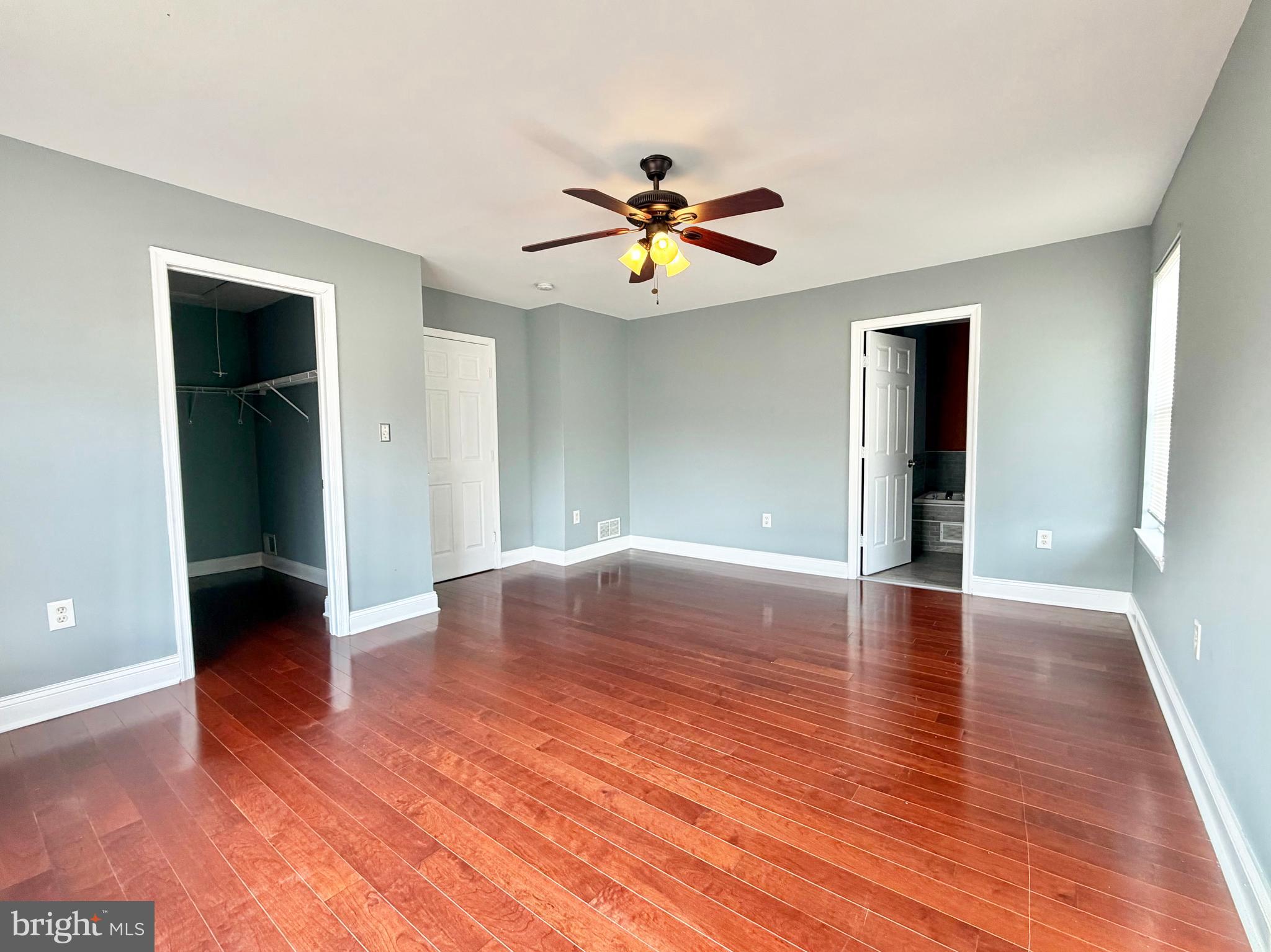 37 Richards Road Lawrenceville, NJ 08648 - Photo 14 of 25 a view of an empty room with window and wooden floor
