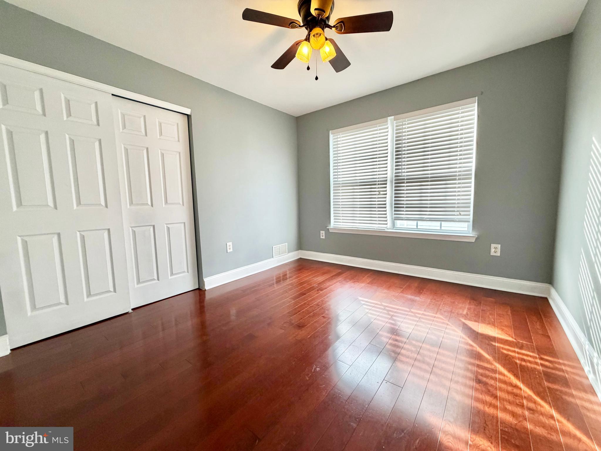 37 Richards Road Lawrenceville, NJ 08648 - Photo 18 of 25 a view of an empty room with window and wooden floor
