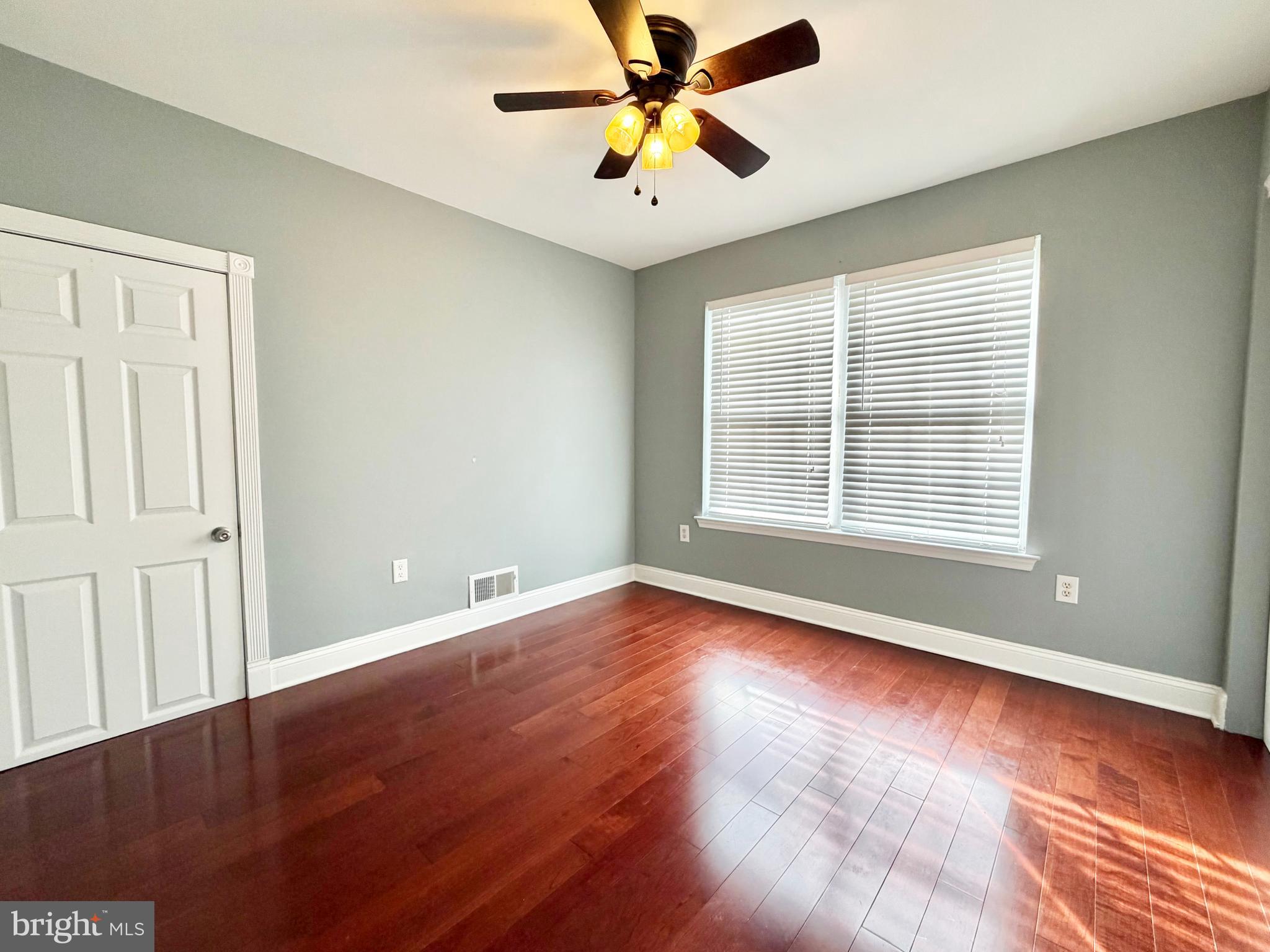 37 Richards Road Lawrenceville, NJ 08648 - Photo 20 of 25 a view of an empty room with window and wooden floor