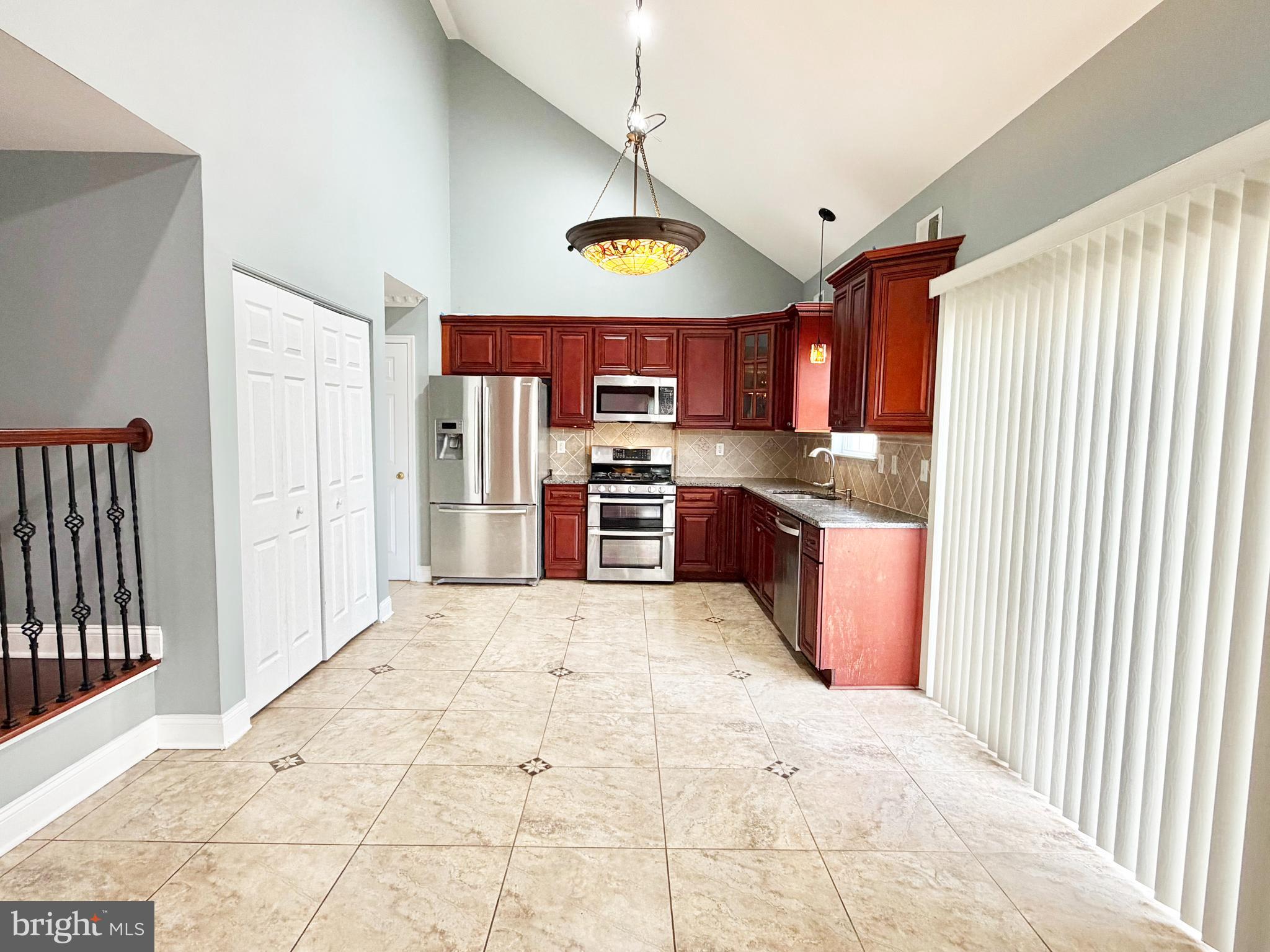 37 Richards Road Lawrenceville, NJ 08648 - Photo 3 of 25 a kitchen with stainless steel appliances granite countertop a stove and a refrigerator