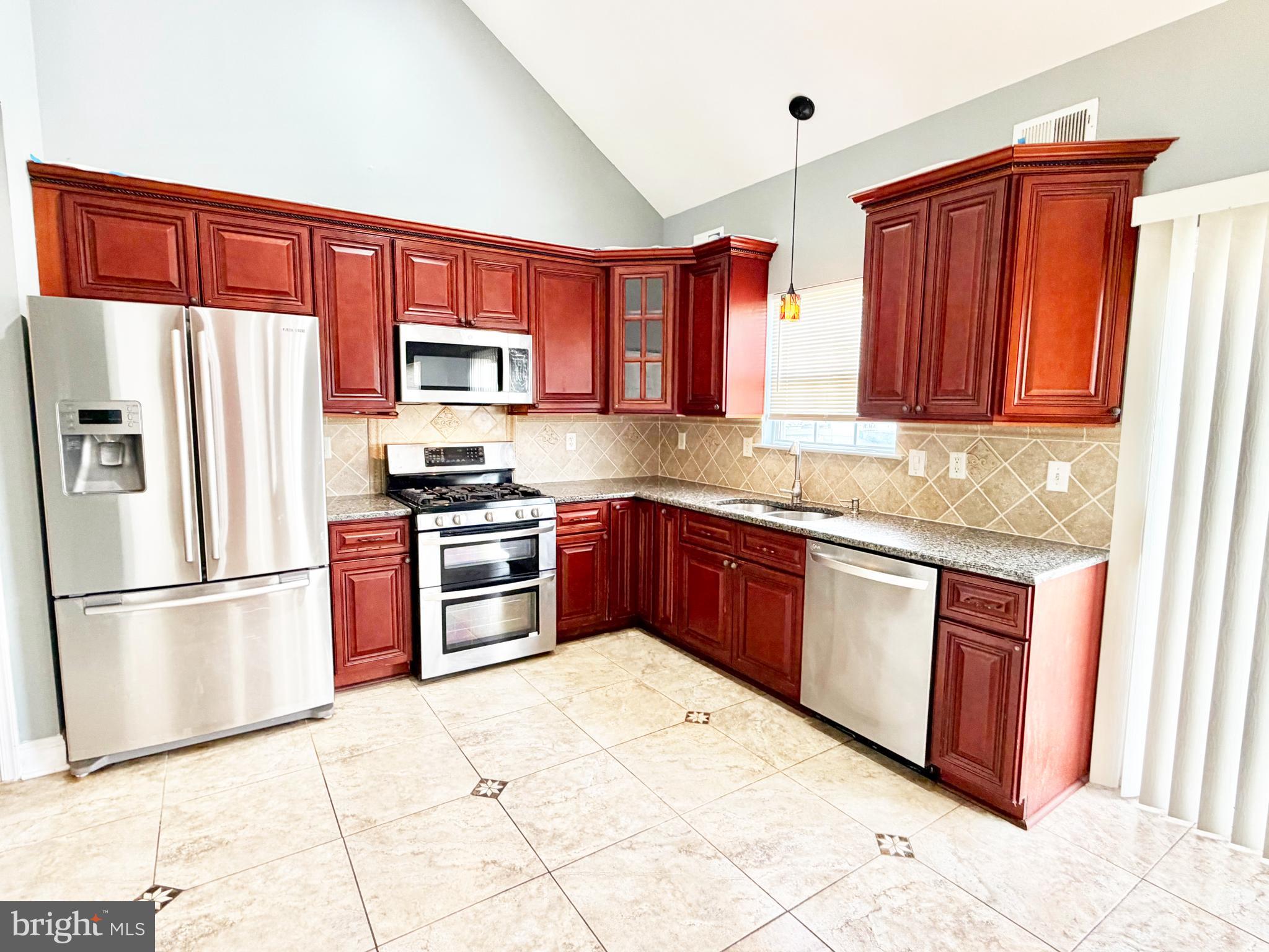 37 Richards Road Lawrenceville, NJ 08648 - Photo 4 of 25 a kitchen with stainless steel appliances granite countertop a refrigerator stove and sink
