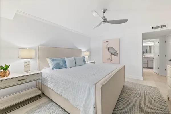 a bedroom with a bed tv and window