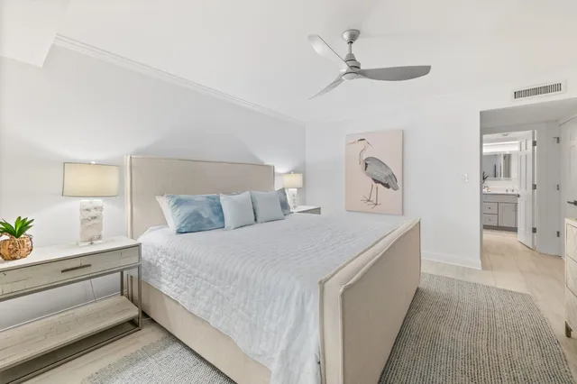 a bedroom with a bed tv and window