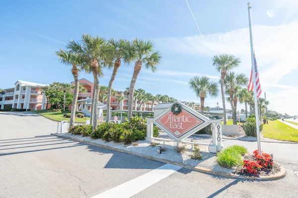 a street view with tall buildings and a street sign