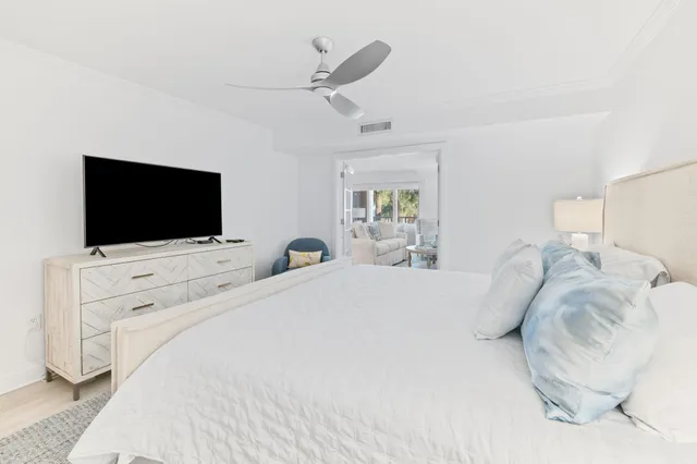a bathroom with a granite countertop sink a mirror a bathtub and shower