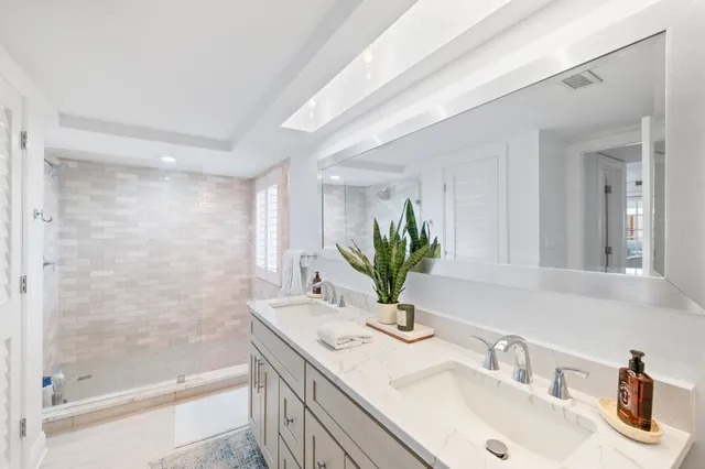 a bathroom with a sink vanity and a mirror
