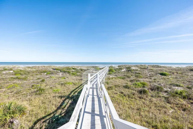 a swimming pool with outdoor seating and yard
