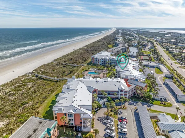an aerial view of residential houses with outdoor space