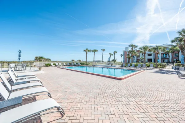 a view of a swimming pool with a lake view