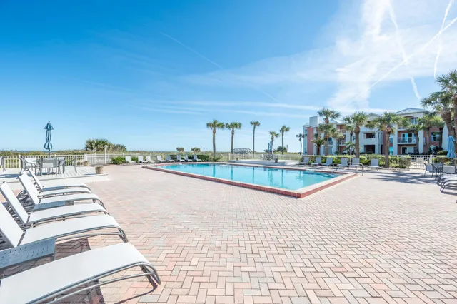 a view of a swimming pool with a lake view