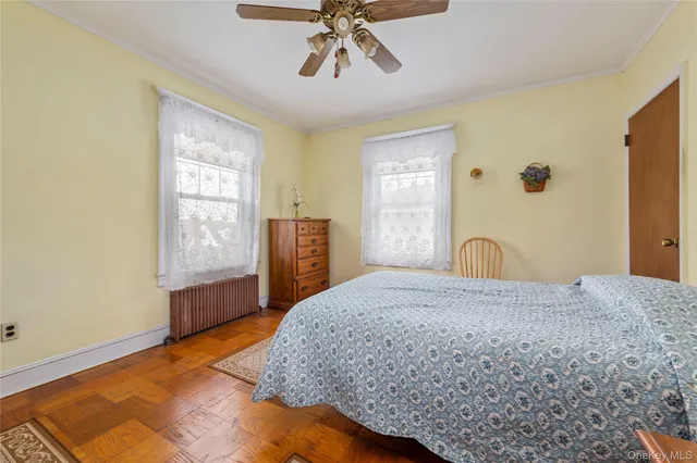 a bedroom with a bed and dresser