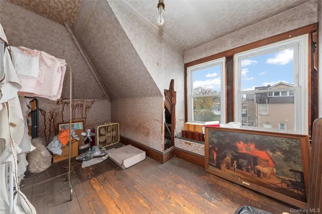 a room with gym equipment and a large window