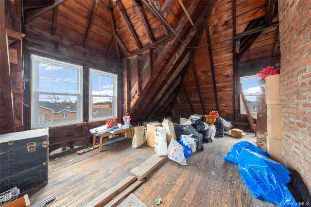 a sitting area with furniture and wooden floor