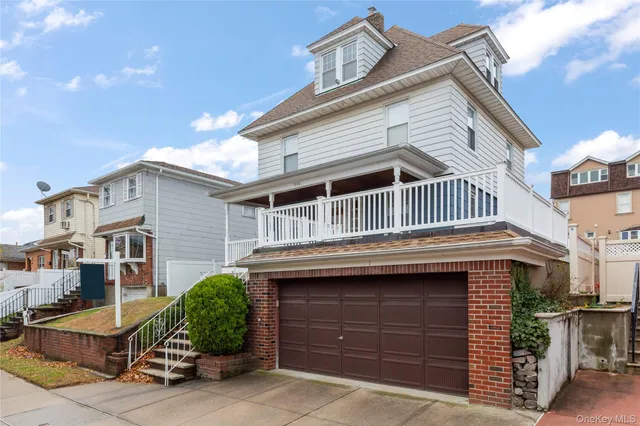 a front view of a house with garage