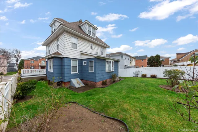 a aerial view of a house with a yard