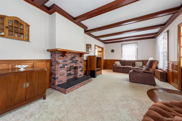 a living room with furniture gym equipment and a window