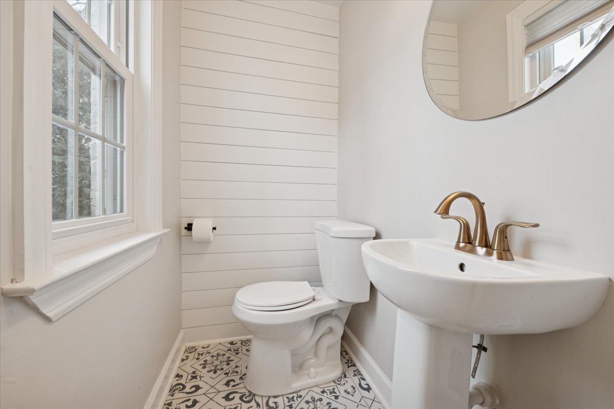 736 Ottawa Avenue Park Ridge, IL 60068 - Photo 12 of 33 a bathroom with a sink a toilet and a mirror