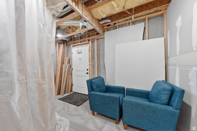 14738 Tangle Hill Road Herriman, UT 84096 - Photo 53 of 66 Unfinished basement area featuring exposed ceiling joists, insulation, wall framing, and concrete flooring