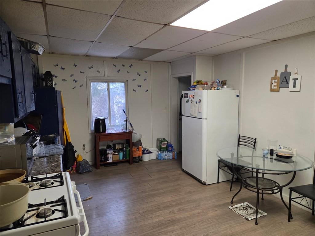 150 Stoebner Way Pittsburgh, PA 15206 - Photo 5 of 5 a room with furniture a refrigerator and a stove