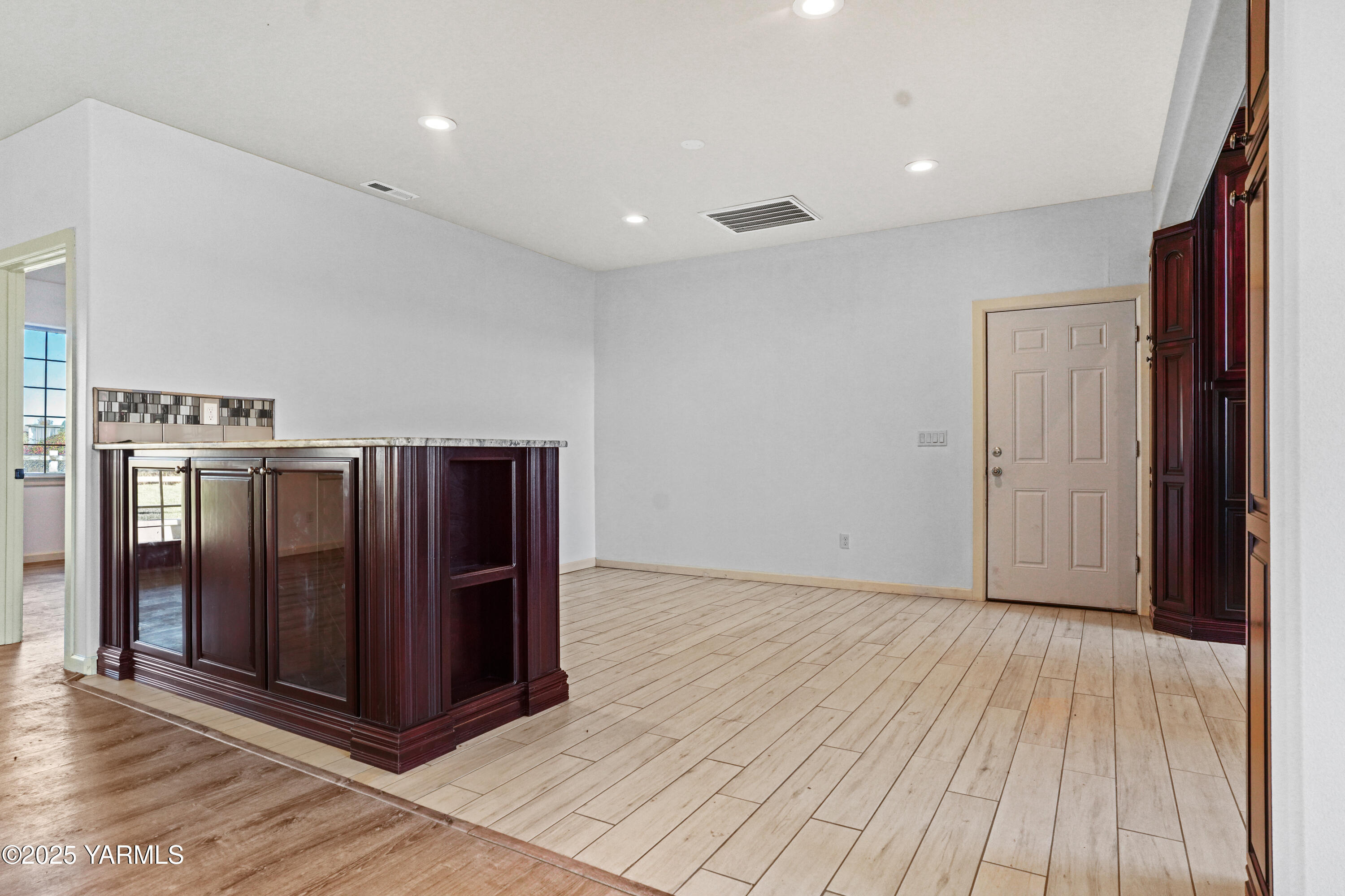 10002 North Wamba Road Prosser, WA 99350 - Photo 17 of 40 a view of a hallway with wooden floor
