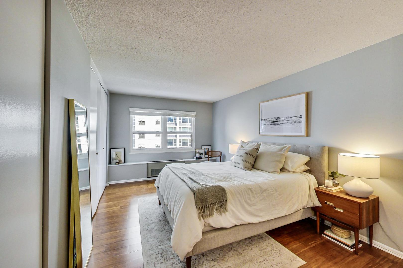 1313 North Ritchie Court, Unit 505 Chicago, IL 60610 - Photo 14 of 27 a bedroom with a bed and a window