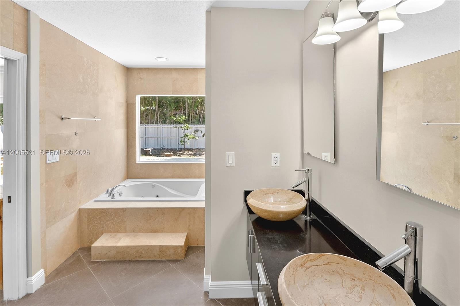 5310 Southwest 72nd Street Miami, FL 33143 - Photo 13 of 20 a bathroom with a toilet a sink and bathtub