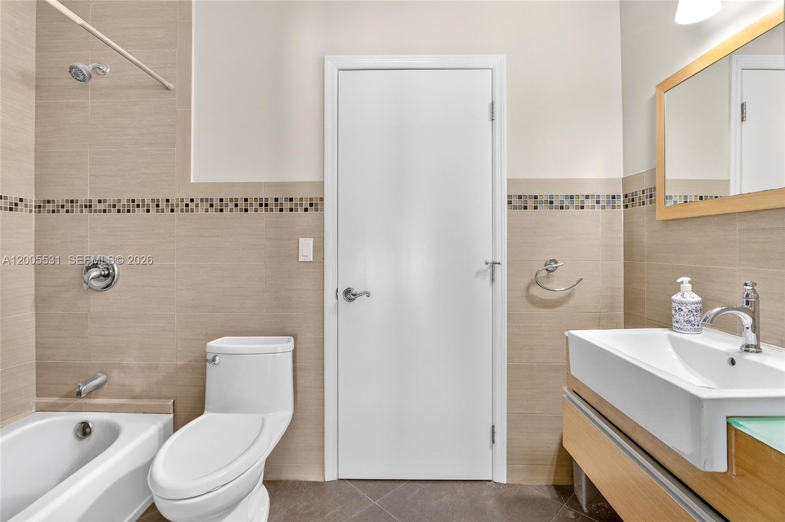 5310 Southwest 72nd Street Miami, FL 33143 - Photo 15 of 20 a bathroom with a sink a toilet and shower
