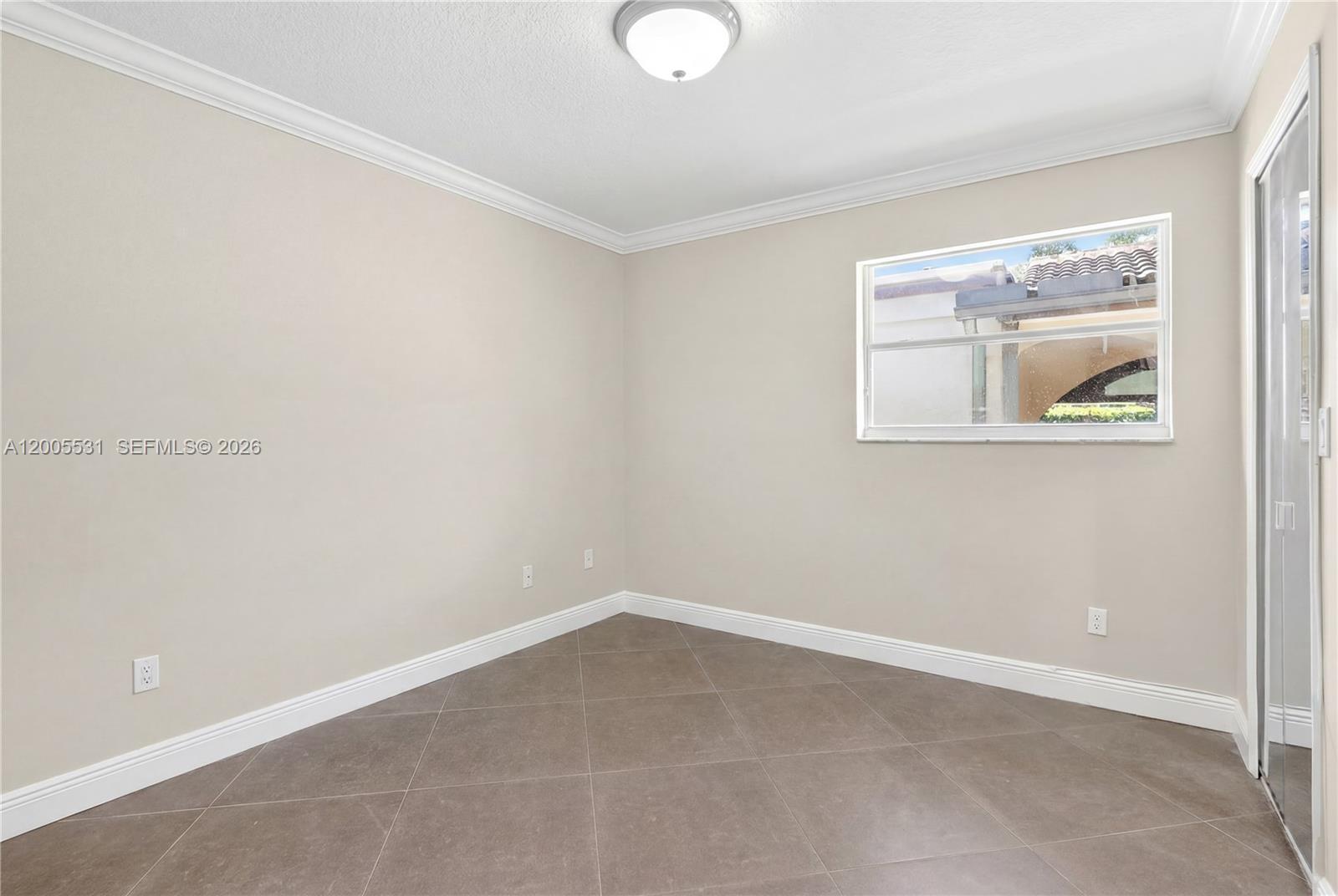 5310 Southwest 72nd Street Miami, FL 33143 - Photo 16 of 20 an empty room with a window
